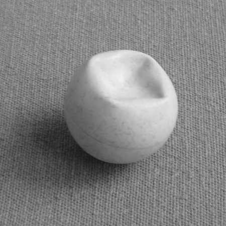 Ping pong ball with a non-axisymmetric buckle caused by a larger concentrated load