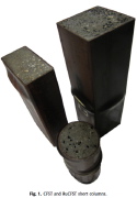 Locally buckled axially compressed stub hollow steel columns filled with rubberized concrete