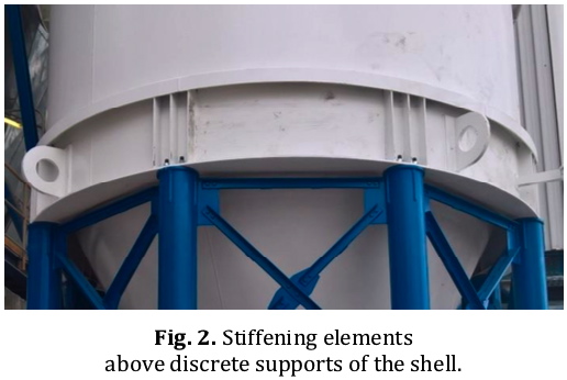 Silo on discrete supports: Axial and circumferential stiffening near the bottom to distribute the concentrated axial compression in the shell wall