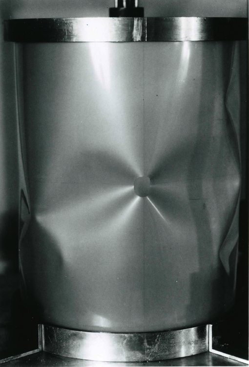 Catastrophic buckling of the axially compressed Mylar cylindrical shell with a small hole
