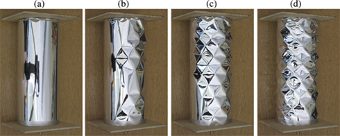 The evolution of the post-buckling pattern of an axially compressed, unstiffened cylindrical shell with increasing axial compression