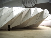 A proposed mobile building for a museum in the shape of a modified Yoshimura pattern of a deeply post-buckled, axially compressed cylindrical shell
