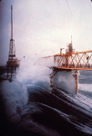 huge waves buffet an offshore oil platform