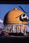 One of the huge LNG spherical storage tanks with a skirt support joined to it at its equator.