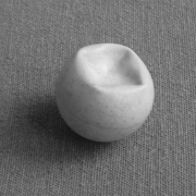 Ping pong ball with a non-axisymmetric buckle caused by a larger concentrated load