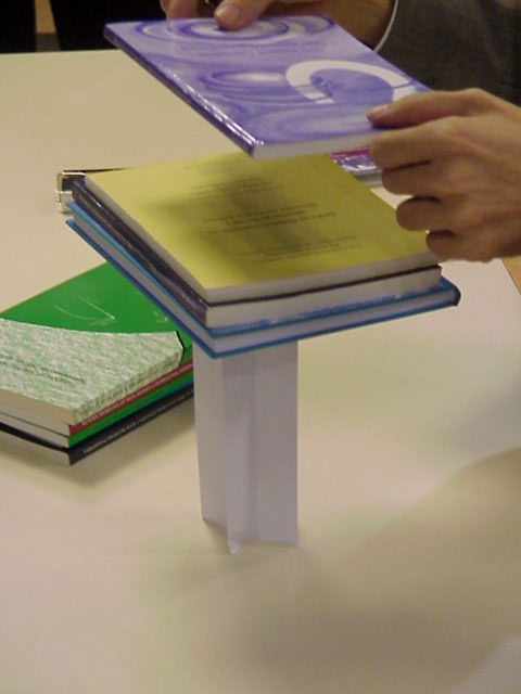 Great strength of an axially compressed paper cruciform column