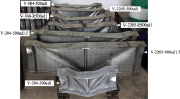 Shear buckling and collapse of various test specimens of vertically stiffened plate girders under vertical concentrated load