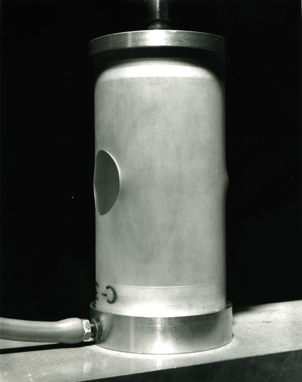 Prebuckling state of the axially compressed Lexan cylindrical shell with a large hole