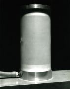 Prebuckling state of the axially compressed Lexan cylindrical shell with a small hole