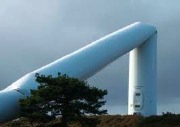 Buckled wind turbine support tower